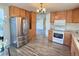 Kitchen boasts stainless steel appliances and ample cabinetry at 7982 Larkspur Cir, Frederick, CO 80530