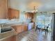 Eat-in kitchen with light wood cabinets and modern appliances at 7982 Larkspur Cir, Frederick, CO 80530