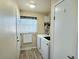 Laundry room with washer, dryer, and extra shelving at 7982 Larkspur Cir, Frederick, CO 80530