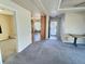 Living area with view into kitchen and entryway at 7982 Larkspur Cir, Frederick, CO 80530