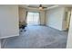 Spacious living room featuring carpeted floors and backyard access at 7982 Larkspur Cir, Frederick, CO 80530