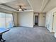 Main bedroom with sliding doors to backyard and ceiling fan at 7982 Larkspur Cir, Frederick, CO 80530