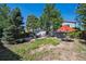 Large lot with patio, backyard, mature trees, and ample space for outdoor activities at 9222 Albion St, Thornton, CO 80229