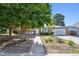Attractive front yard with mature trees that provide shade and complement this charming home at 9222 Albion St, Thornton, CO 80229