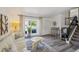 Inviting living room featuring modern decor, stylish flooring, a cozy seating area, and a staircase at 9222 Albion St, Thornton, CO 80229