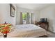Cozy bedroom with ample natural light, neutral tones, and a desk for a workspace at 4385 S Balsam St # 3-101, Littleton, CO 80123