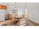 Cozy dining area featuring a classic wooden table and chairs, complemented by ample storage and natural light at 4385 S Balsam St # 3-101, Littleton, CO 80123