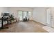 Bright living area with plush carpeting, featuring large windows and a door offering ample natural light and style at 4385 S Balsam St # 3-101, Littleton, CO 80123