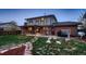 View of the backyard with patio, trees, and nice landscaping at 10321 W 101St Pl, Broomfield, CO 80021