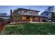 View of the backyard and patio with a home's exterior at 10321 W 101St Pl, Broomfield, CO 80021