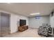 Finished basement area featuring neutral carpet, and comfortable chair at 10321 W 101St Pl, Broomfield, CO 80021