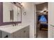 Bathroom featuring updated vanity and fixtures with access to bedroom at 10321 W 101St Pl, Broomfield, CO 80021
