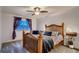 Bright bedroom with decorative headboard and a window at 10321 W 101St Pl, Broomfield, CO 80021