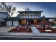 Charming two-story home with brick and siding exterior, a two-car garage, and a professionally landscaped front yard at 10321 W 101St Pl, Broomfield, CO 80021
