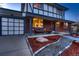 Inviting front of home with brick accents, well-manicured landscaping, and a two-car garage providing curb appeal at 10321 W 101St Pl, Broomfield, CO 80021