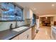 Kitchen sink area featuring updated faucet, countertops, and backsplash at 10321 W 101St Pl, Broomfield, CO 80021