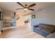 Open-concept living area with hardwood floors leading to staircase at 10321 W 101St Pl, Broomfield, CO 80021
