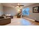 Spacious living room with ample natural light and hardwood floors at 10321 W 101St Pl, Broomfield, CO 80021