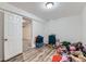 Spacious basement playroom with laminate floors, ample lighting, and a closet at 246 S 22Nd Ave, Brighton, CO 80601