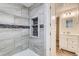 Elegant bathroom with a tiled shower niche and a vanity with a large mirror at 246 S 22Nd Ave, Brighton, CO 80601
