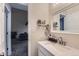 Modern bathroom with single vanity and view of living room at 246 S 22Nd Ave, Brighton, CO 80601