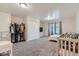 Spacious bedroom with window, closet, and crib at 246 S 22Nd Ave, Brighton, CO 80601