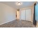 Bright bedroom with carpet, double closet and access to hallway at 246 S 22Nd Ave, Brighton, CO 80601