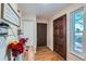 Inviting entryway with hardwood floors, storage, and a window with a view to the outside at 246 S 22Nd Ave, Brighton, CO 80601