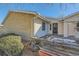 Brick and siding exterior, mature landscaping, and a wooden retaining wall at 246 S 22Nd Ave, Brighton, CO 80601