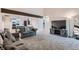 Open living room with neutral-toned carpet, comfortable furniture, and natural light at 246 S 22Nd Ave, Brighton, CO 80601