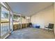Enclosed sunroom featuring brick and vinyl accents, with outdoor views and space for relaxation at 246 S 22Nd Ave, Brighton, CO 80601