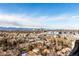 Stunning aerial view showcasing city skyline and mountain backdrop at 3131 E Alameda Ave # 2002, Denver, CO 80209