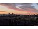 City skyline and mountain views at sunset at 3131 E Alameda Ave # 2002, Denver, CO 80209