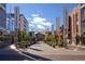 Cherry Creek North street view featuring pedestrian area, storefronts, and decorative signage under a sunny sky at 3131 E Alameda Ave # 2002, Denver, CO 80209