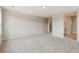 Bright, spacious room with neutral walls, carpet, and multiple doorways at 39751 Congress Ln, Elizabeth, CO 80107