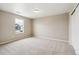 Neutral bedroom featuring soft carpet, a window for natural light, and a spacious closet at 39751 Congress Ln, Elizabeth, CO 80107