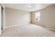 Neutral carpeted bedroom with neutral walls, one window, and a light-colored carpet at 39751 Congress Ln, Elizabeth, CO 80107