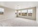 Spacious bedroom with large windows offering great light, neutral walls, and new carpet at 39751 Congress Ln, Elizabeth, CO 80107