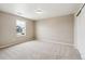 Neutral bedroom with beige carpet and walls, a window, and closet; ready for personalization at 39751 Congress Ln, Elizabeth, CO 80107