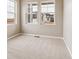 Bright bedroom with neutral walls and carpet, complemented by natural light from two windows at 39751 Congress Ln, Elizabeth, CO 80107
