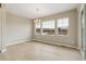 Open dining area featuring neutral walls, modern chandelier, wood-look floors, and natural light at 39751 Congress Ln, Elizabeth, CO 80107