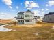 New two-story home with gray siding and many windows at 39751 Congress Ln, Elizabeth, CO 80107