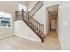 Hallway featuring hardwood floors, staircase, and a view of the modern interior design at 39751 Congress Ln, Elizabeth, CO 80107