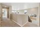 Upstairs hallway with natural light, carpet, wooden banister staircase, and neutral paint at 39751 Congress Ln, Elizabeth, CO 80107