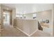 Open hallway with carpet, bright windows and a view of the neighborhood from the stairs at 39751 Congress Ln, Elizabeth, CO 80107