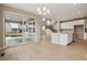 Open-concept kitchen features stainless appliances, light countertops, and a seamless flow to the patio at 39751 Congress Ln, Elizabeth, CO 80107