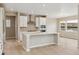 Modern kitchen featuring white cabinetry, stainless steel appliances, and a large island at 39751 Congress Ln, Elizabeth, CO 80107