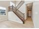 Staircase featuring carpet steps, stained wood trim, large windows, and wood-look flooring at 39751 Congress Ln, Elizabeth, CO 80107