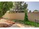 Fenced backyard featuring low-maintenance landscaping and mature shade trees at 11186 E Baltic Dr, Aurora, CO 80014