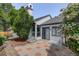 Outdoor patio area with tiled surface and blossoming shrubs, perfect for entertaining at 11186 E Baltic Dr, Aurora, CO 80014